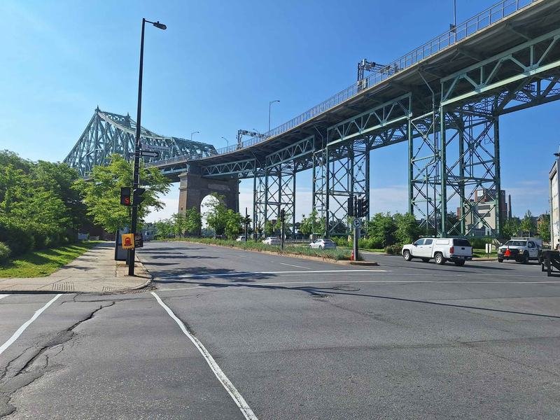 The green steel Jacques-Cartier Bridge at the east end of the Village